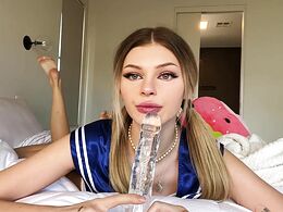 Blonde With Pigtails Sucks A Dildo