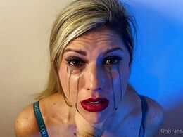He squeezes her by the throat until she cries
