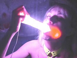 Illuminated dildo goes down her throat