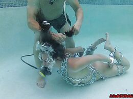 In the water with a hook in her ass