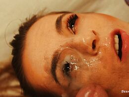 He's playing with his cock in her eye
