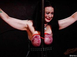 Traumatized slave pig sobs as her udders are bound & ass is beaten with prison strap